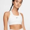 Nike Women's Dri-FIT Swoosh Sports Bra in White/Black -The Sports Edit Store nike dri fit swoosh sports bra white black BV3636 100 1