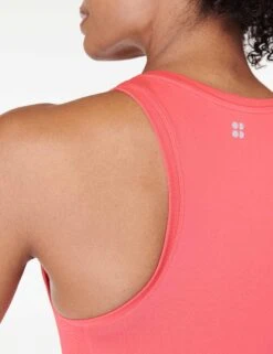 Sweaty Betty Athlete Crop Seamless Gym Vest - Coral Pink -The Sports Edit Store sweaty betty athlete crop seamless gym vest coral pink sb6545c 3