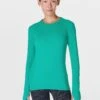 Sweaty Betty Athlete Seamless Gym Long Sleeve Top - Gem Green 1 Sweaty Betty Athlete Seamless Gym Long Sleeve Top - Gem Green -The Sports Edit Store sweaty betty athlete seamless gym long sleeve top green sb6547 1