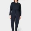 Sweaty Betty Explorer Long Sleeve Jumpsuit - Black 1 Sweaty Betty Explorer Long Sleeve Jumpsuit - Black -The Sports Edit Store sweaty betty explorer long sleeve jumpsuit black sb8506 fl 1