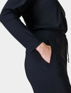Sweaty Betty Explorer Long Sleeve Jumpsuit - Black -The Sports Edit Store sweaty betty explorer long sleeve jumpsuit black sb8506 fl 2