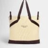 Sweaty Betty SB Canvas Bucket Bag - Buttercream Yellow -The Sports Edit Store sweaty betty sb canvas bucket bag buttercream yellow sb10224 1
