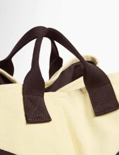 Sweaty Betty SB Canvas Bucket Bag - Buttercream Yellow -The Sports Edit Store sweaty betty sb canvas bucket bag buttercream yellow sb10224 4